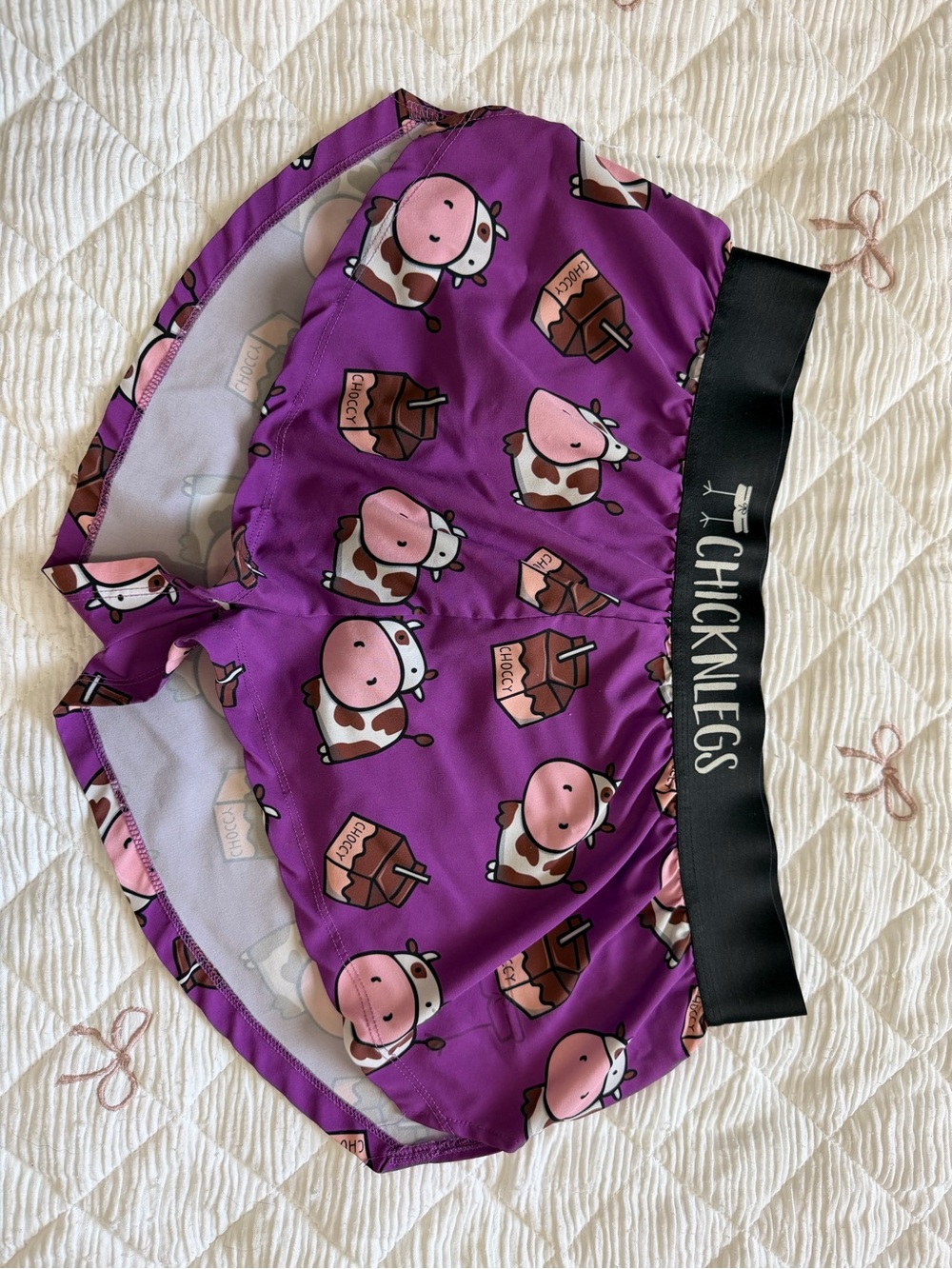 Womenโs Athletic Shorts โ Purple Cow Print with Black Elastic Waistband